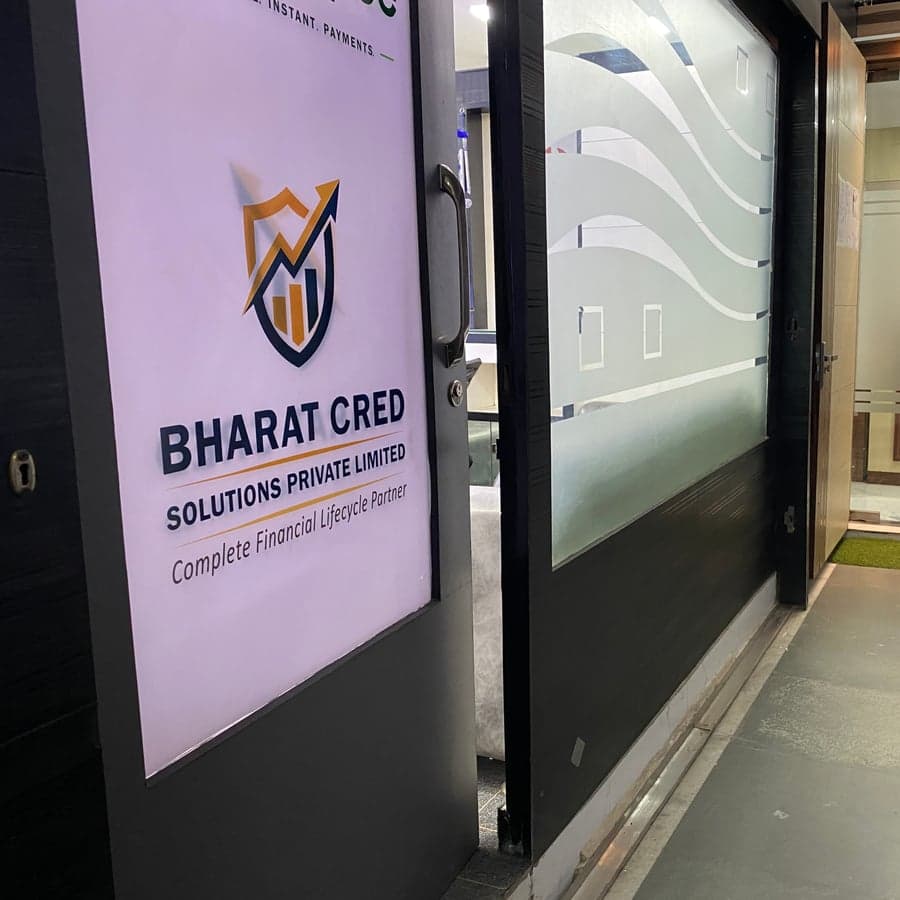 Bharat Cred Solutions office entrance with logo and tagline